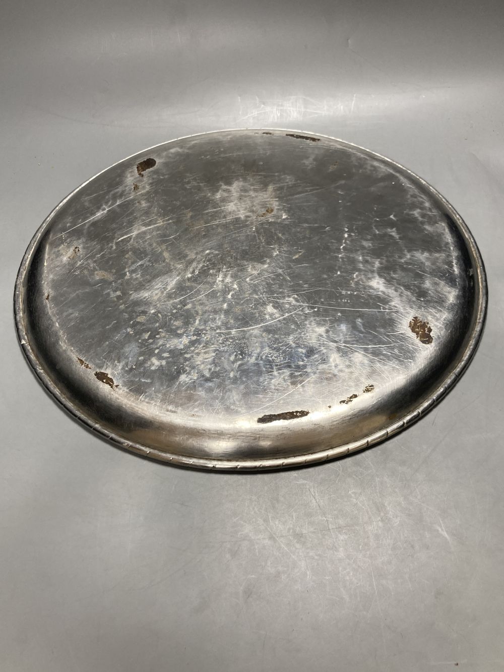 A Keswick School of Industrial Arts planished pewter tray, diameter 38cm